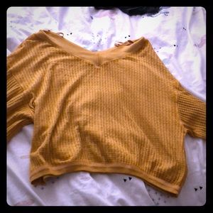 A orange long sleeve sweater